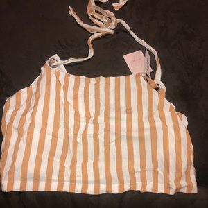 Crop tan top shows off back